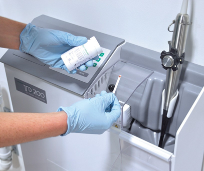 Test strip being used to confirm MRC of high-level disinfectant